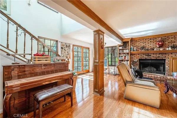 a view of living room with furniture and fireplace