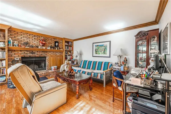 a living room with furniture fireplace and flat screen tv