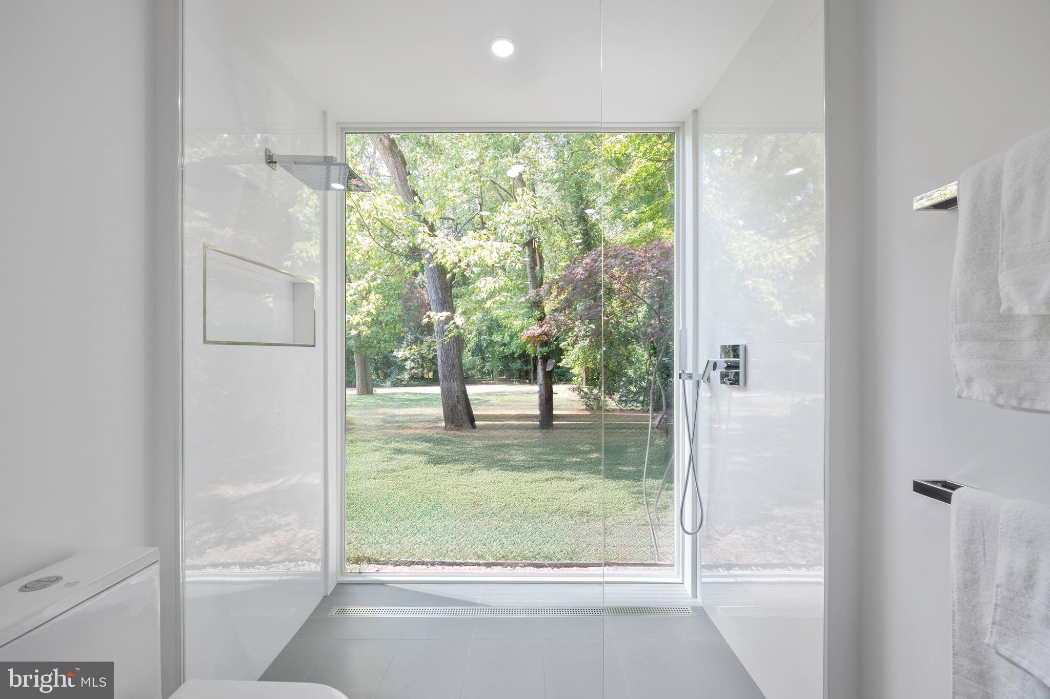 7602 Range Road Alexandria, VA 22306 - Photo 34 of 56 Primary shower with wall of windows
