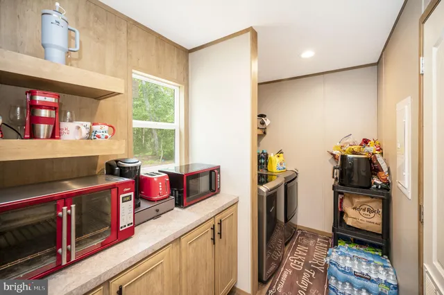 a kitchen with stainless steel appliances a stove and a refrigerator