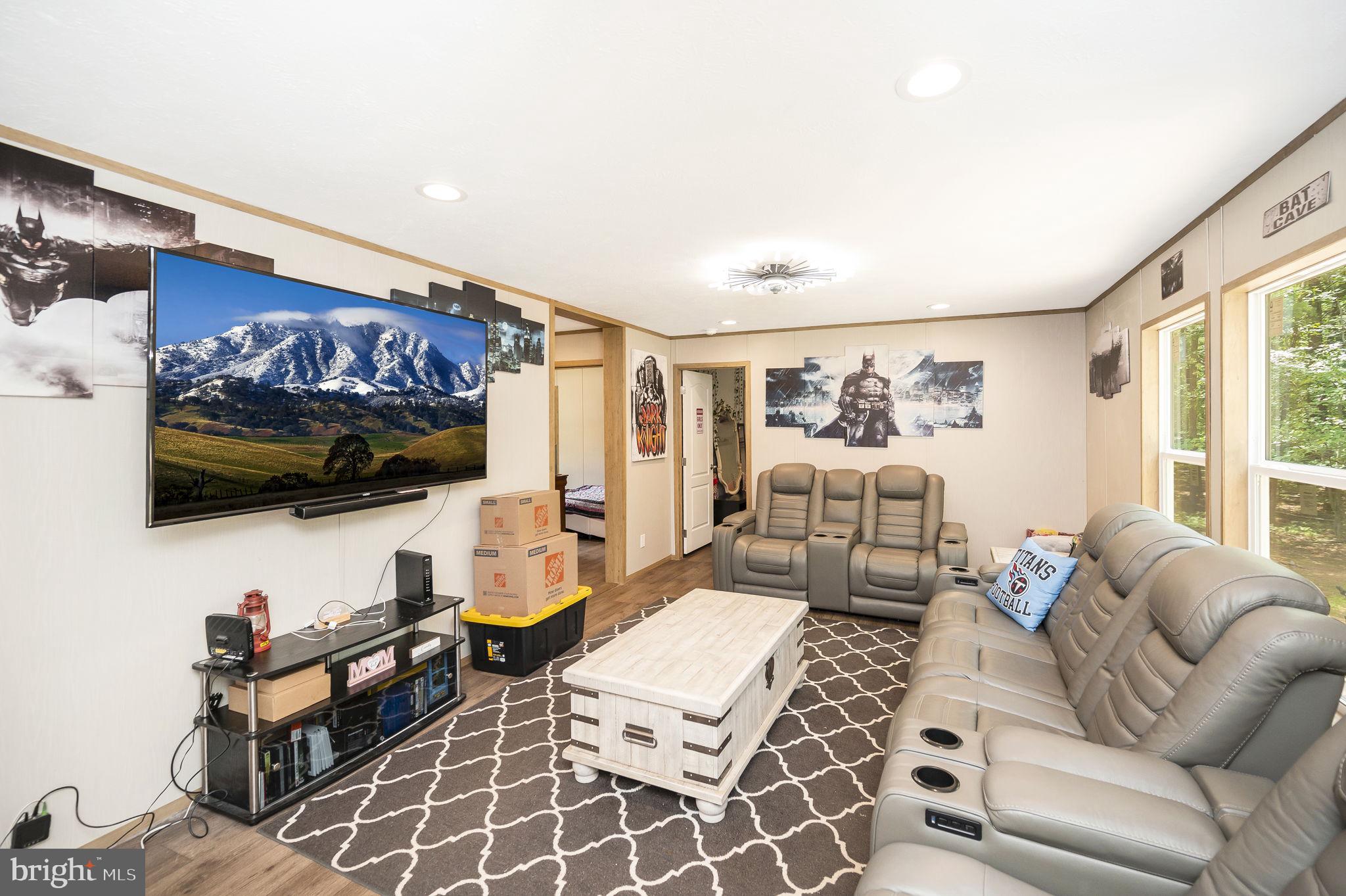 23066 Independence Road Unionville, VA 22567 - Photo 19 of 39 a living room with furniture and a flat screen tv