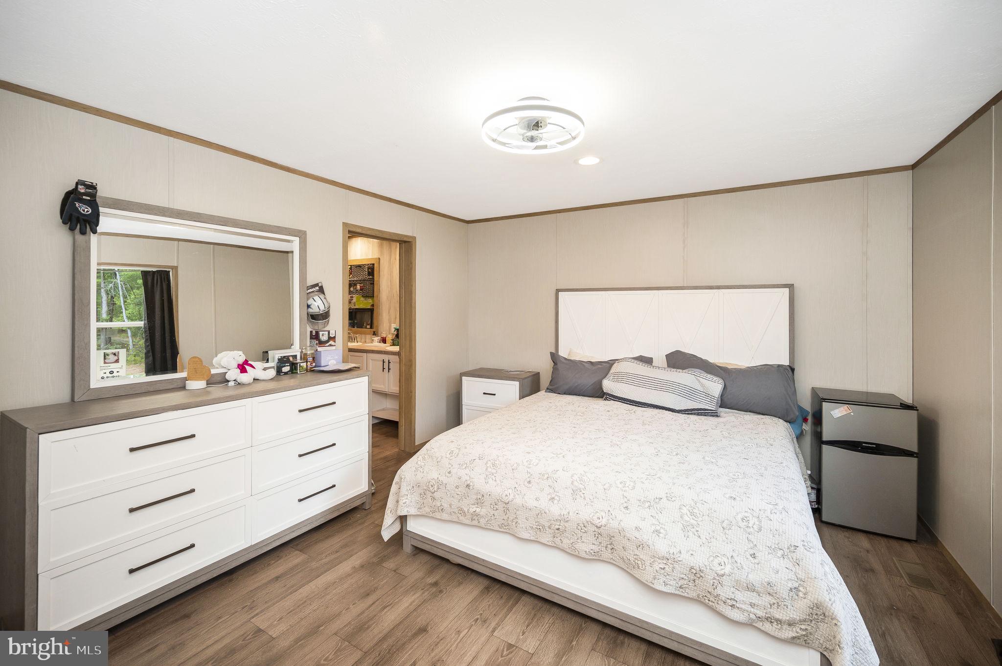 23066 Independence Road Unionville, VA 22567 - Photo 21 of 39 a bedroom with a bed and a mirror