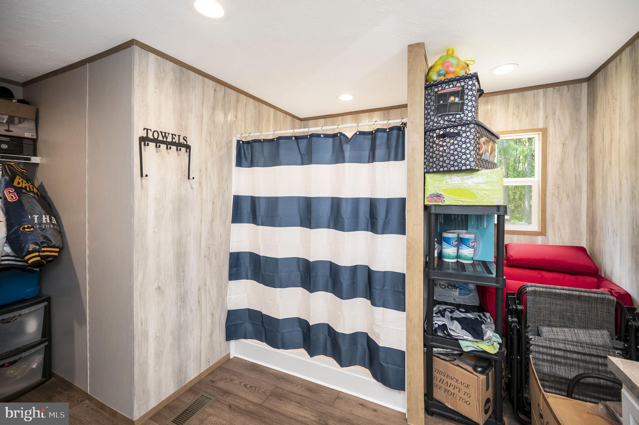 23066 Independence Road Unionville, VA 22567 - Photo 23 of 39 a bathroom with a bathtub and a shower