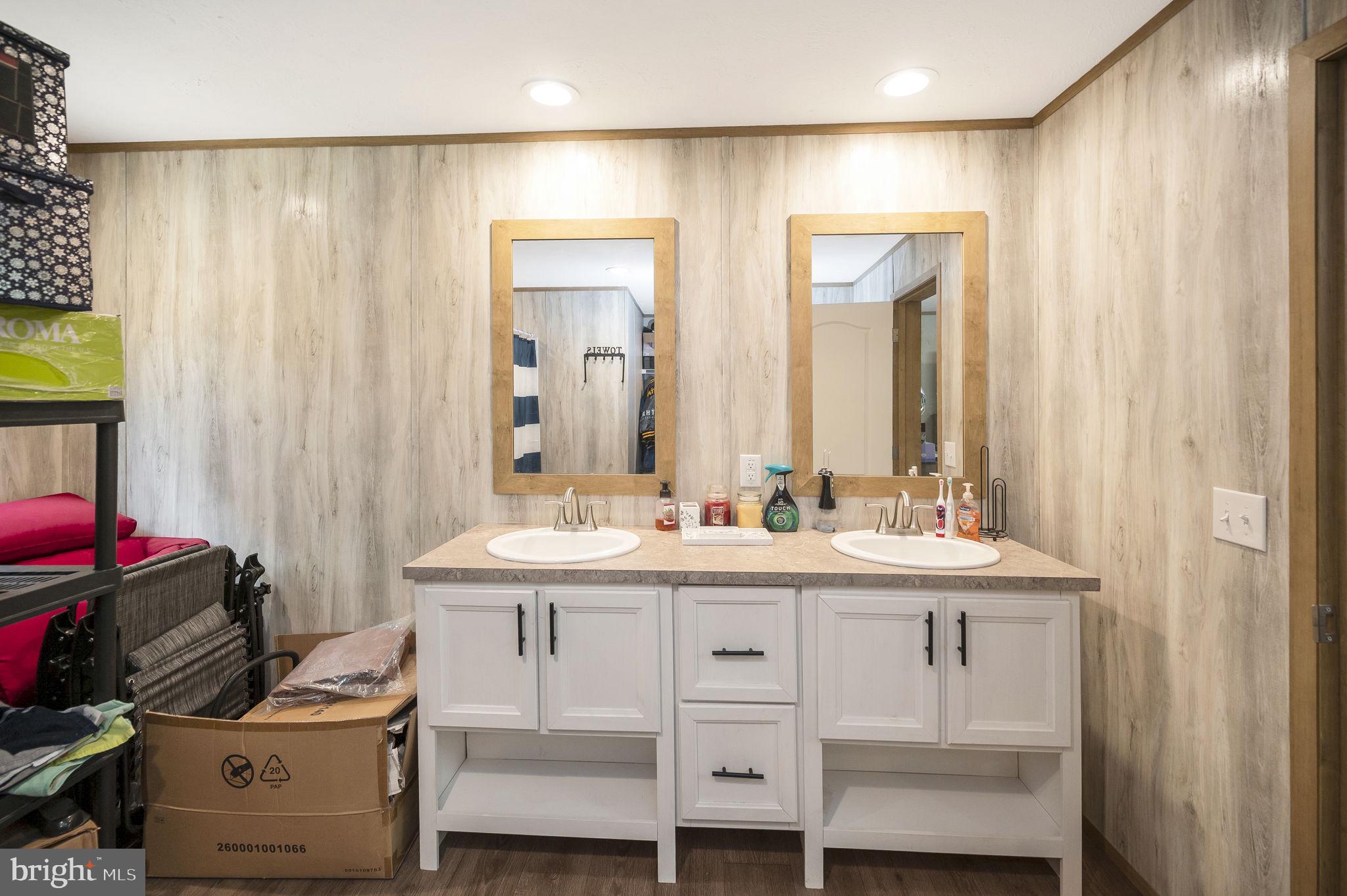 23066 Independence Road Unionville, VA 22567 - Photo 24 of 39 a bathroom with a sink a toilet and mirror