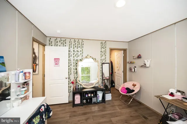 a view of a livingroom with furniture and window