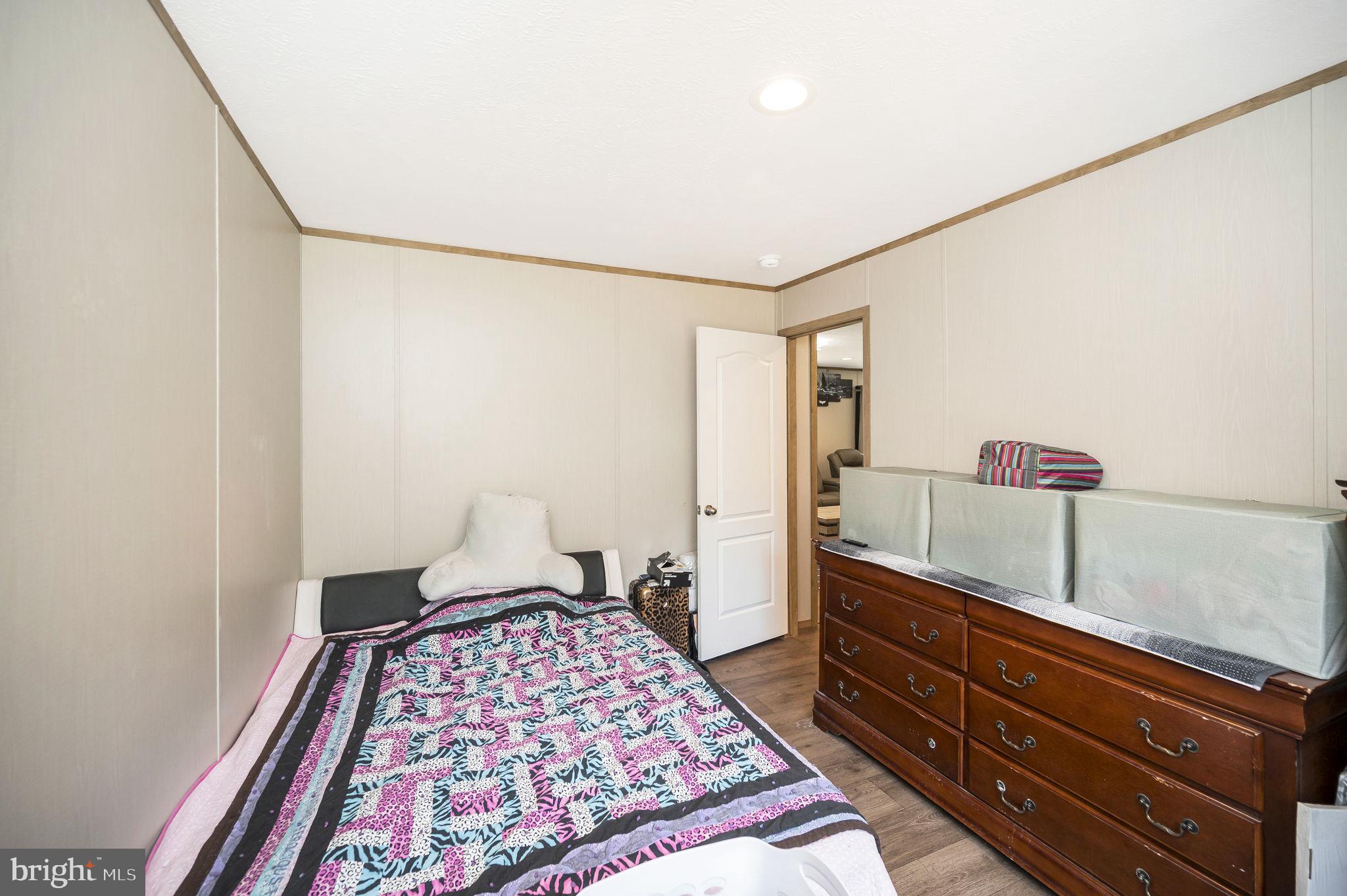 23066 Independence Road Unionville, VA 22567 - Photo 28 of 39 a bedroom with a bed and a dresser