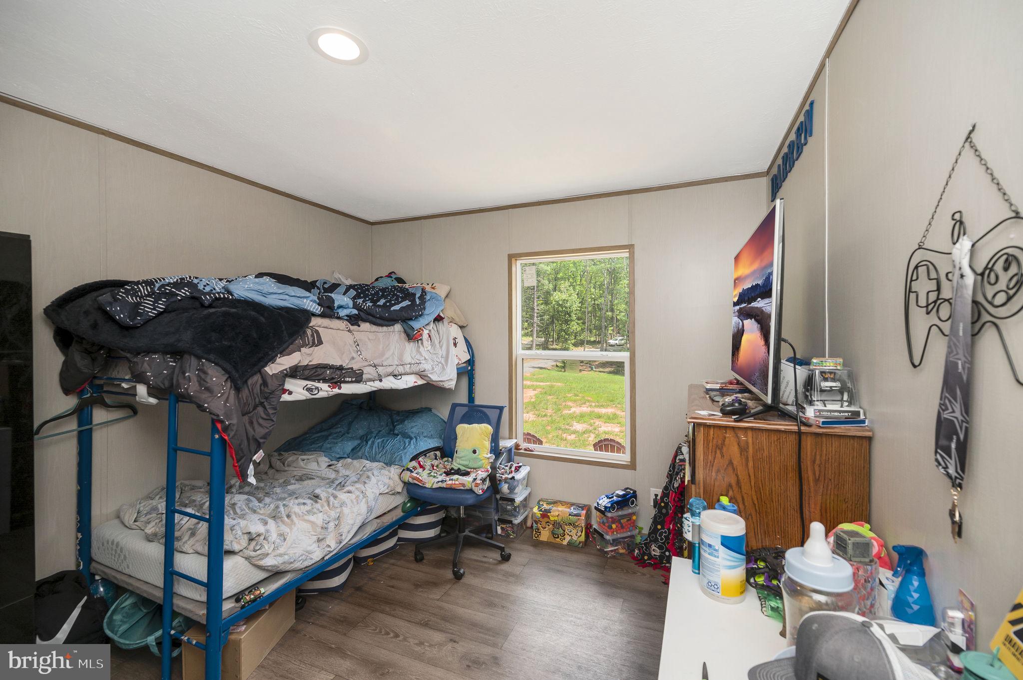 23066 Independence Road Unionville, VA 22567 - Photo 30 of 39 a bedroom with a bed and a window