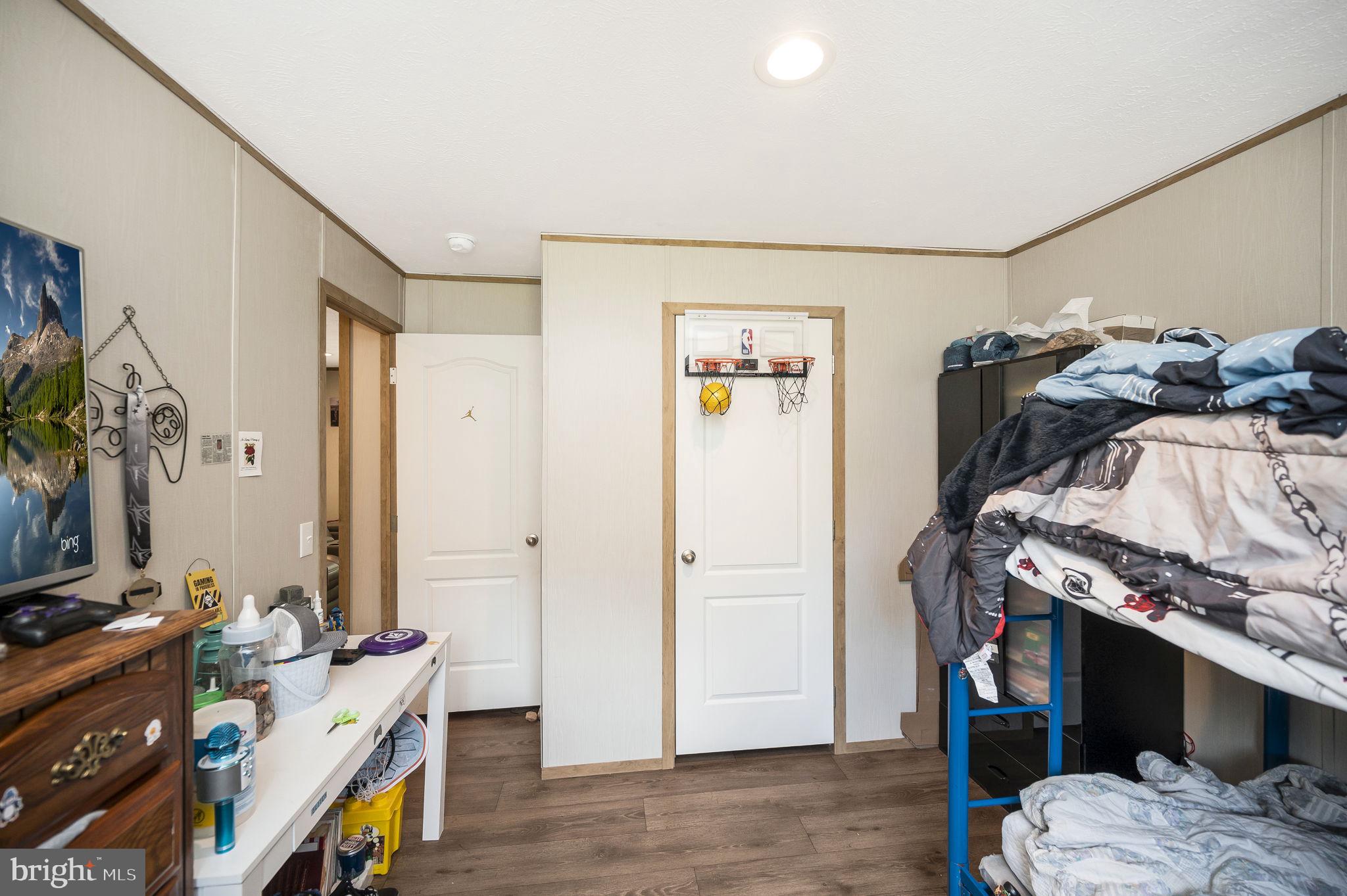 23066 Independence Road Unionville, VA 22567 - Photo 31 of 39 a view of bedroom with furniture and flat screen tv