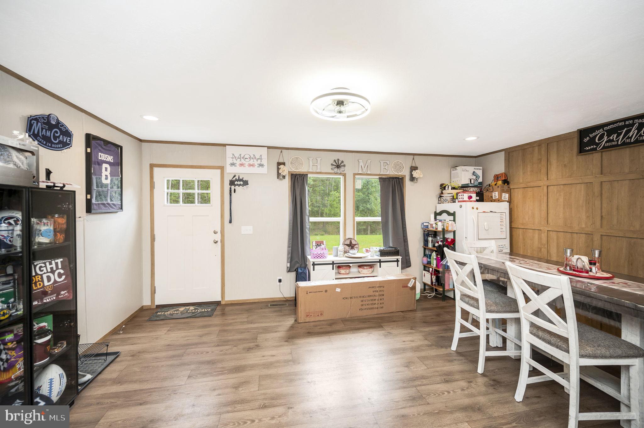 23066 Independence Road Unionville, VA 22567 - Photo 7 of 39 a view of a kitchen with furniture and wooden floor
