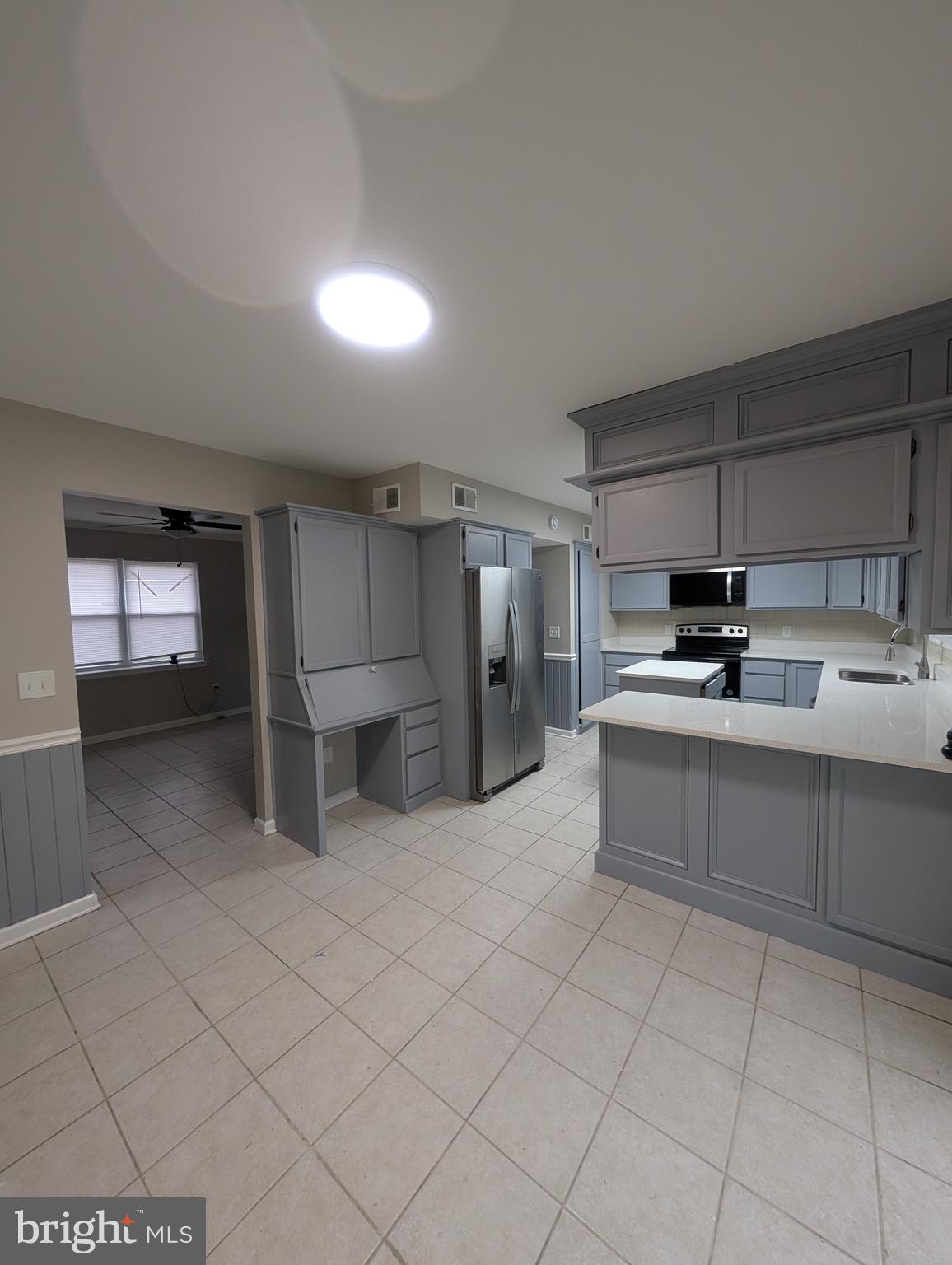 2 Hawkesbury Court Newark, DE 19702 - Photo 15 of 57 a kitchen with stainless steel appliances kitchen island granite countertop a sink and cabinets