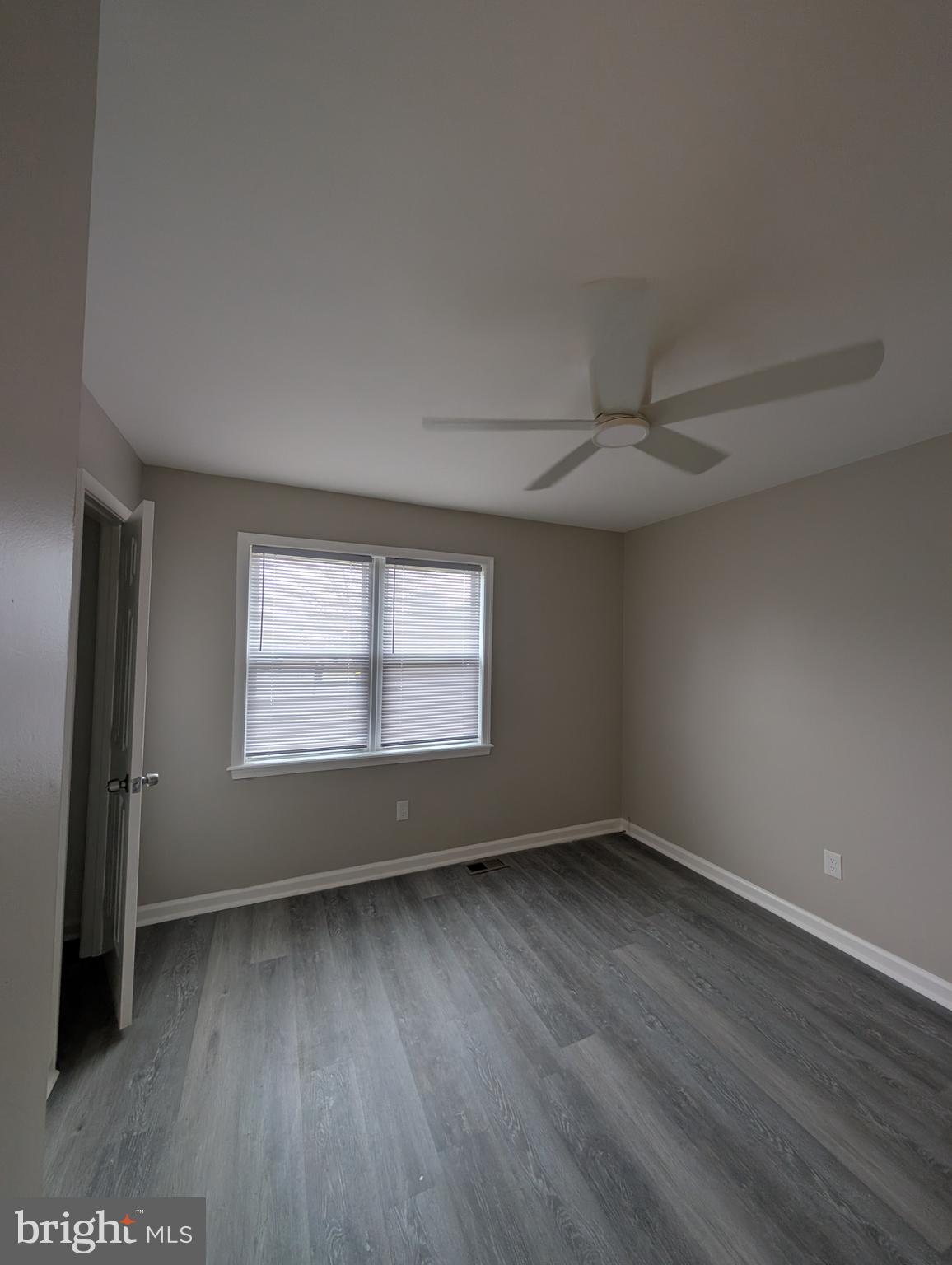 2 Hawkesbury Court Newark, DE 19702 - Photo 22 of 57 an empty room with wooden floor and windows
