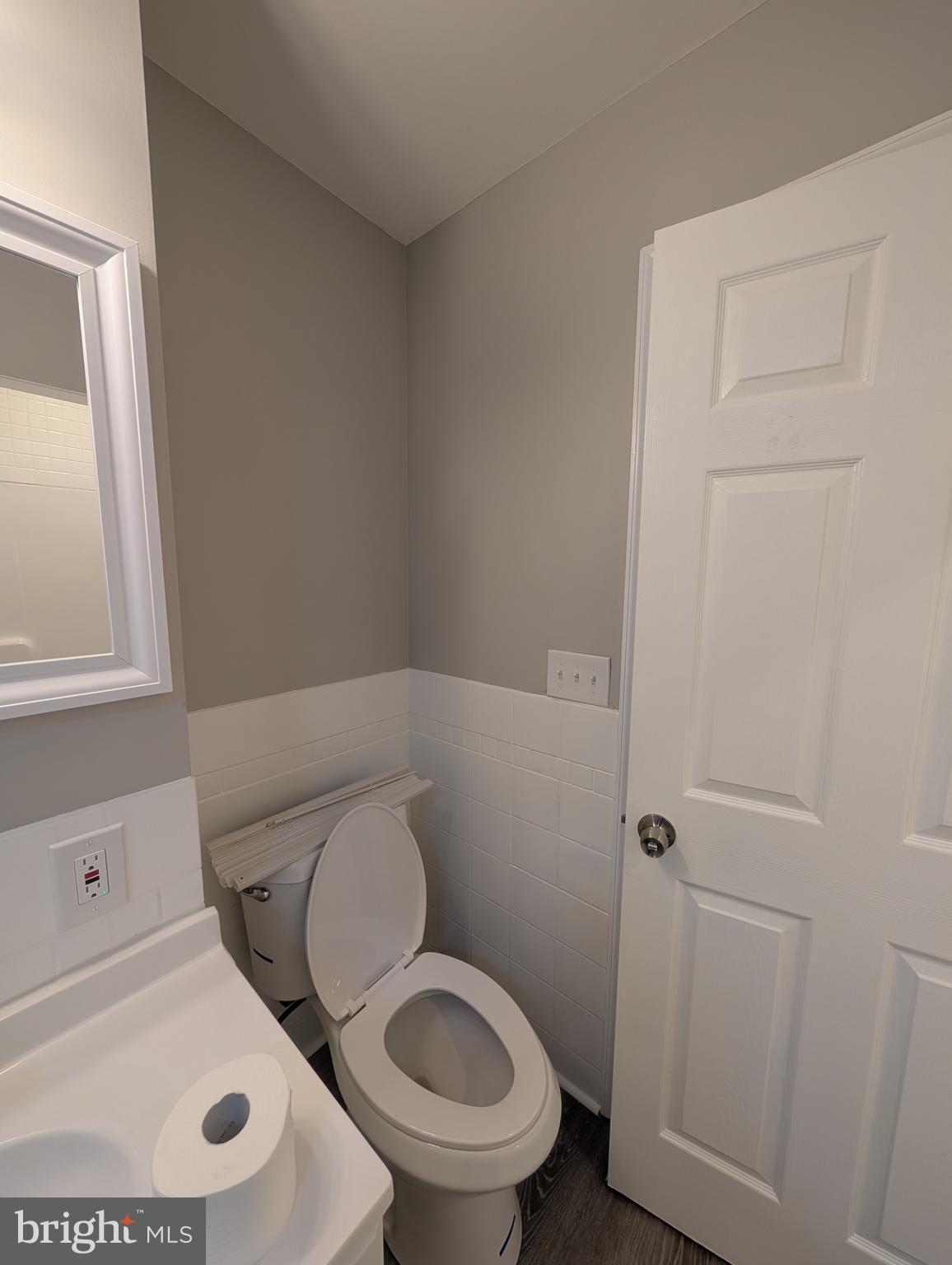 2 Hawkesbury Court Newark, DE 19702 - Photo 32 of 57 a white toilet sitting next to a bathroom sink and vanity