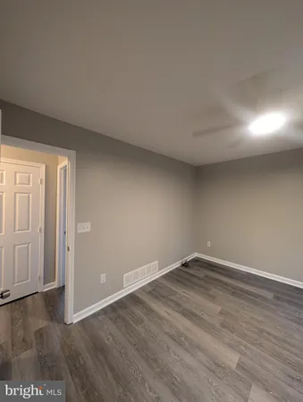 a bathroom with a sink a toilet and bathtub