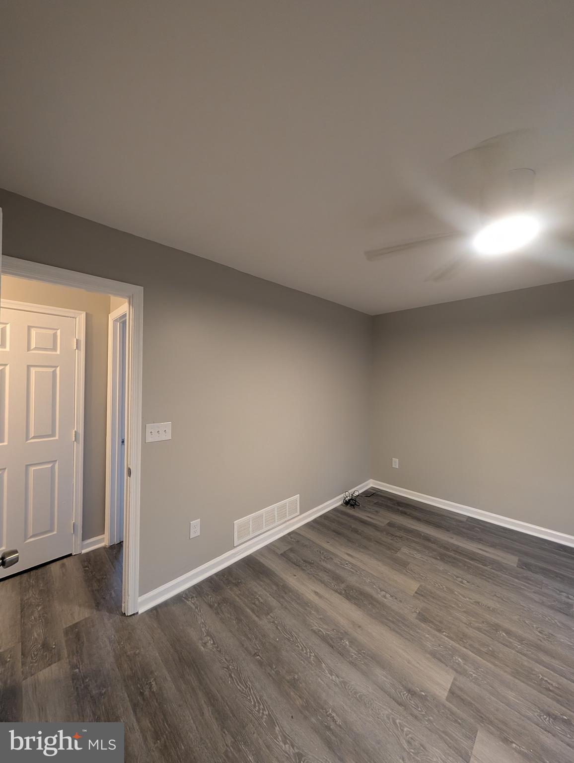 2 Hawkesbury Court Newark, DE 19702 - Photo 34 of 57 an empty room with wooden floor and windows