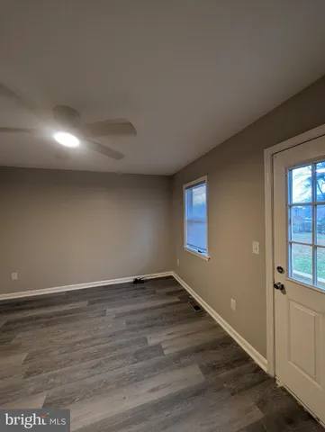 a bathroom with a sink a mirror and shower