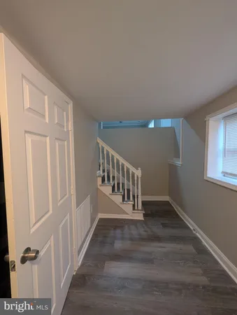 a view of wooden floor in an empty room