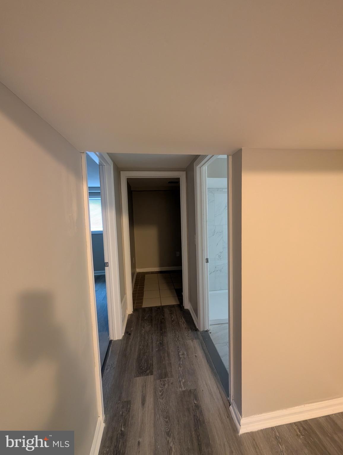 2 Hawkesbury Court Newark, DE 19702 - Photo 48 of 57 a view of a hallway with wooden floor and a bathroom