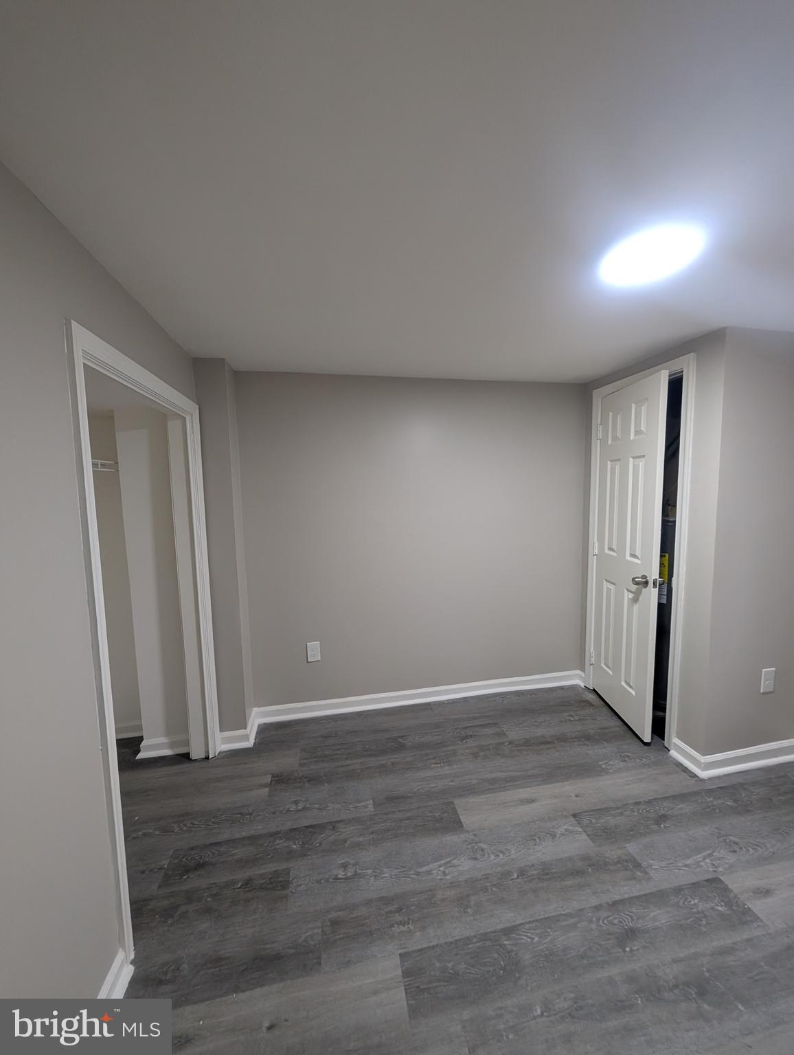 2 Hawkesbury Court Newark, DE 19702 - Photo 49 of 57 an empty room with wooden floor and windows
