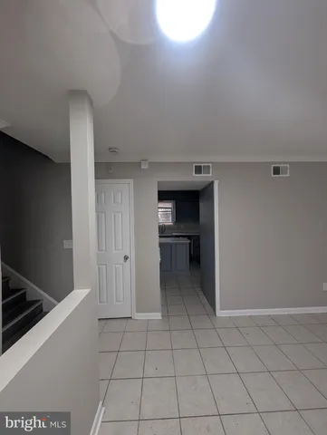 a kitchen with a sink and a stove top oven