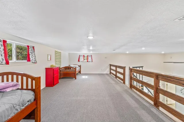 a view of game room with windows