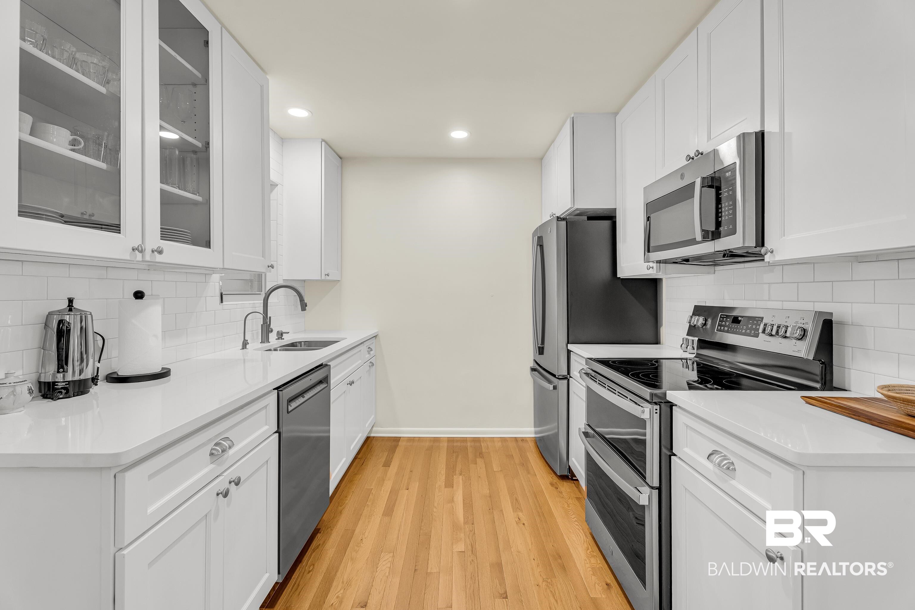 357 Azalea Street Fairhope, AL 36532 - Photo 5 of 22 Kitchen with tasteful backsplash, appliances with stainless steel finishes, glass insert cabinets, white cabinets, and recessed lighting