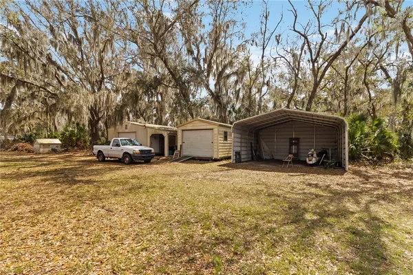 a view of a lake with a house in the background
