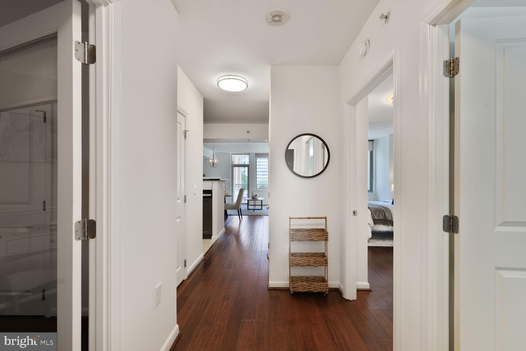 851 North Glebe Road, Unit 409 Arlington, VA 22203 - Photo 3 of 26 a view of a hallway with wooden floor and a bathroom