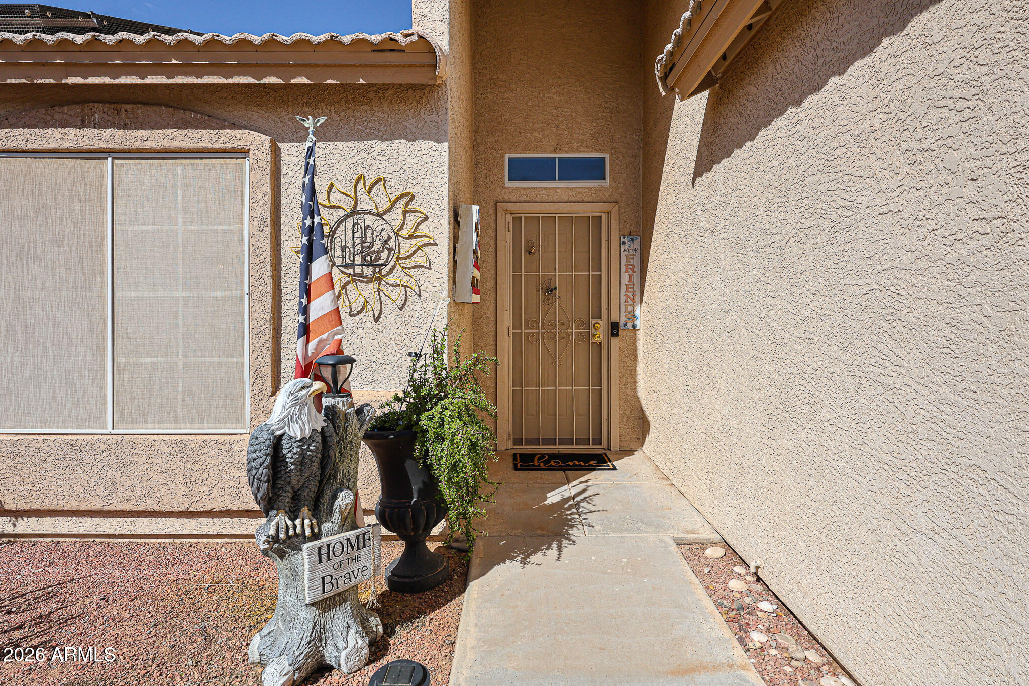 14980 South Capistrano Road Arizona City, AZ 85123 - Photo 3 of 39 a view of a house with a potted plant