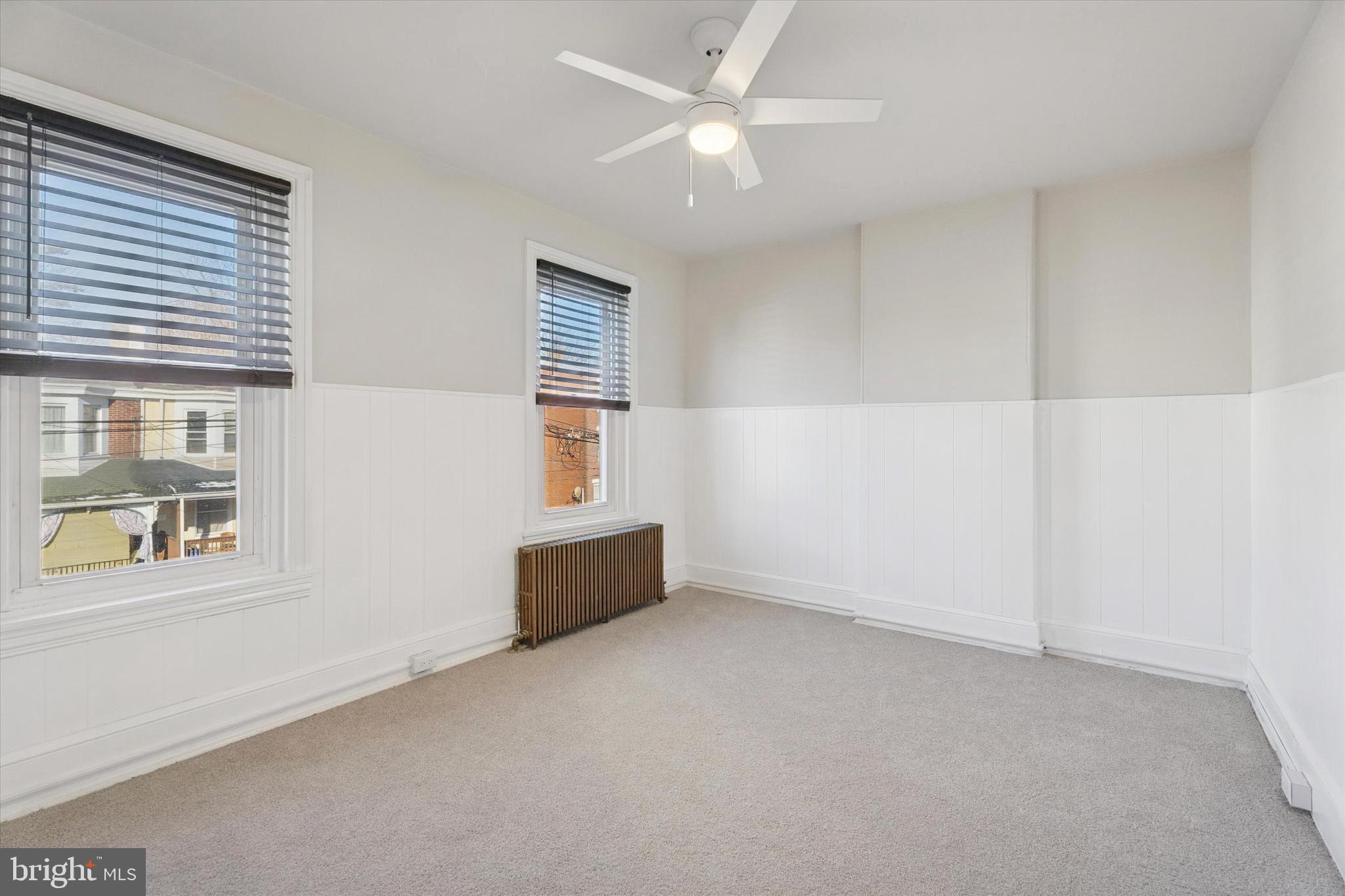 810 George Street Norristown, PA 19401 - Photo 12 of 15 an empty room with windows and fan