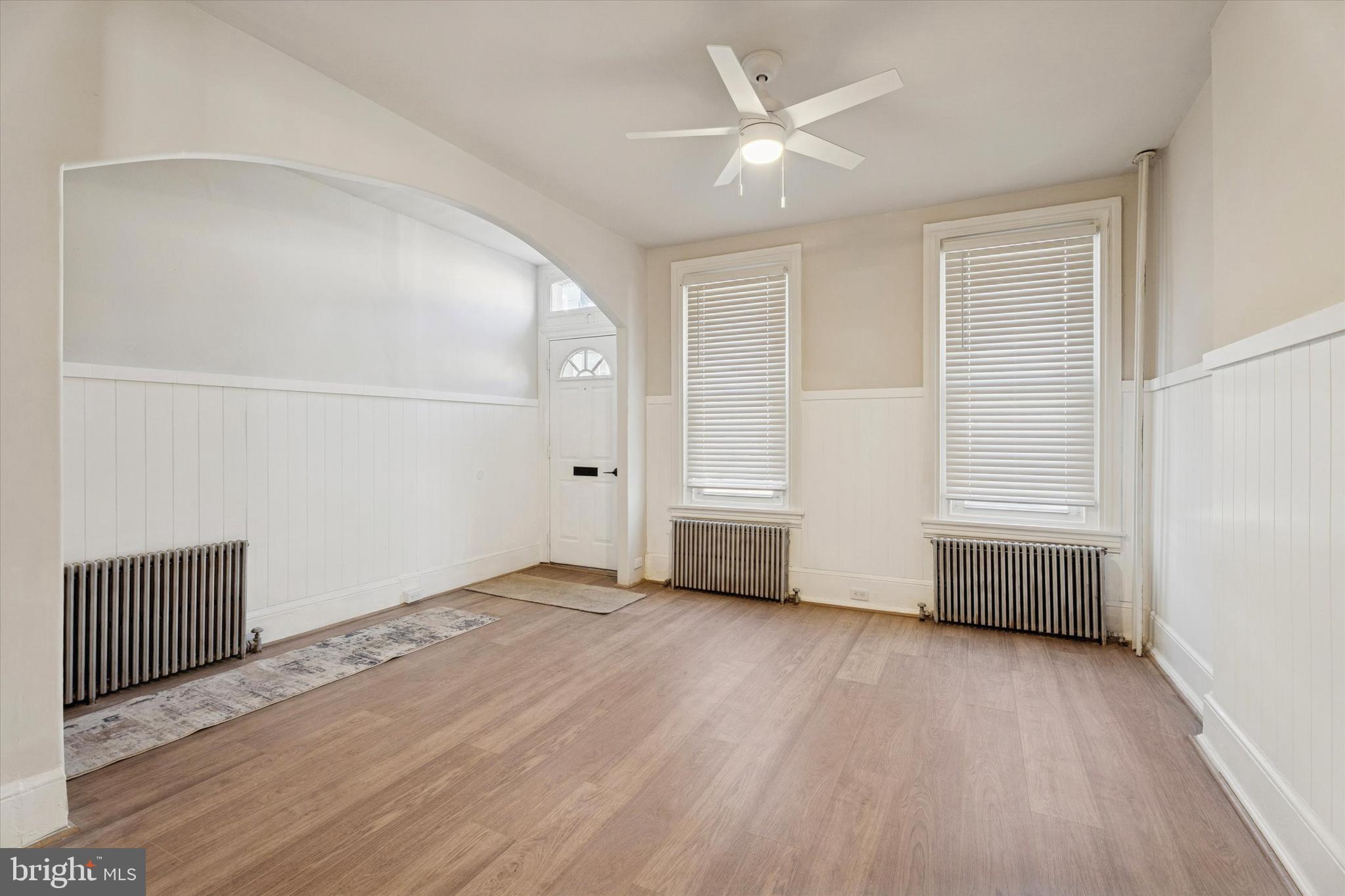 810 George Street Norristown, PA 19401 - Photo 3 of 15 an empty room with wooden floor and window