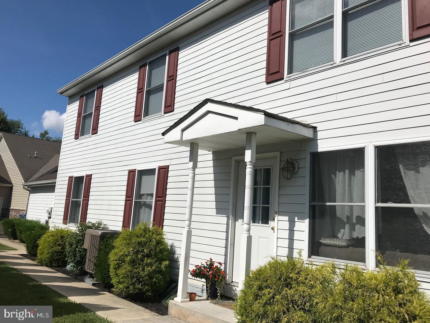 Charming exterior with covered entrance.