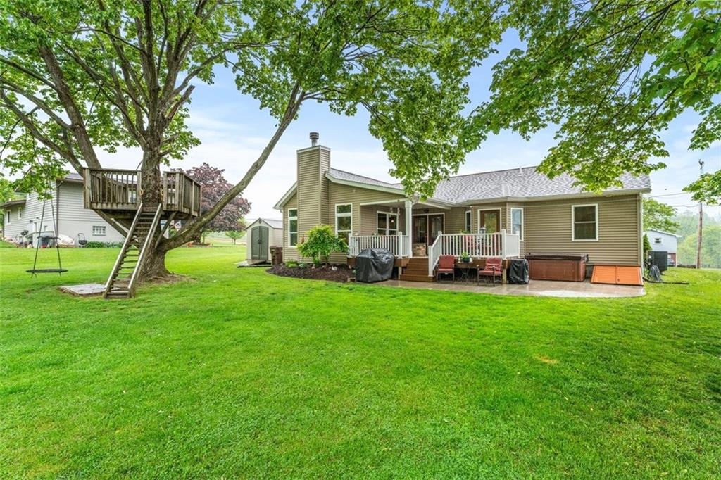 626 Wilson Mill Road New Castle, PA 16105 - Photo 3 of 32 a view of a house with a backyard and a tree