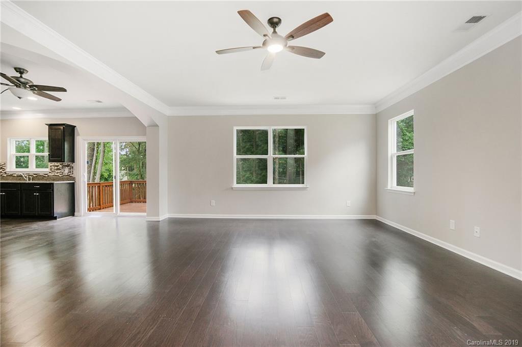 10244 Withers Road Charlotte, NC 28278 - Photo 5 of 17 a view of an empty room with wooden floor and a window