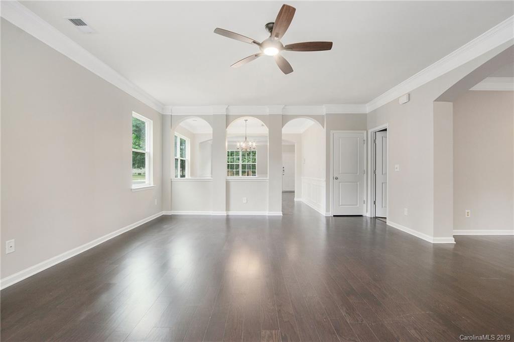 10244 Withers Road Charlotte, NC 28278 - Photo 6 of 17 a view of an empty room with window and wooden floor