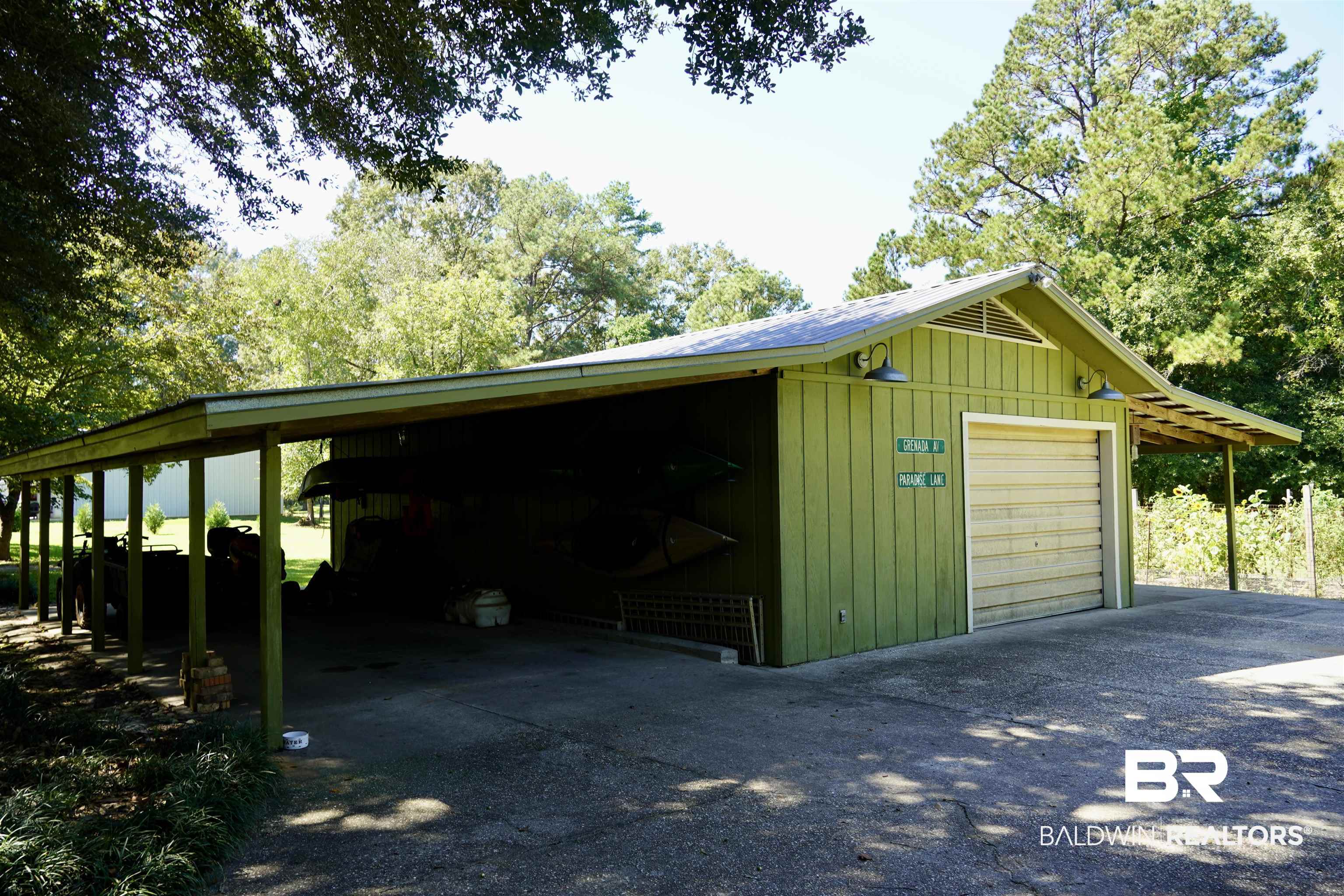 117 Belle Meade Brewton, AL 36426 - Photo 45 of 62 Exterior space with wooden walls and a carport