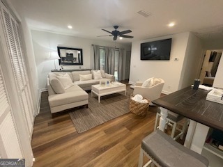 620 Executive Golf Villas Road St. Simons, GA 31522 - Photo 1 of 23 a living room with furniture and a flat screen tv