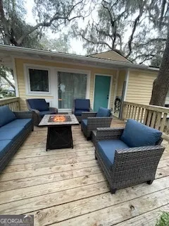 a view of outdoor space yard deck patio and fire pit