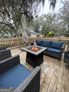 620 Executive Golf Villas Road St. Simons, GA 31522 - Photo 16 of 23 a outdoor living space with furniture and a potted plant