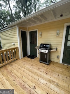 620 Executive Golf Villas Road St. Simons, GA 31522 - Photo 22 of 23 a kitchen with stainless steel appliances kitchen island a stove a sink and a refrigerator