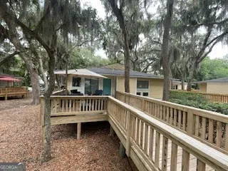 a view of a bench and a yard