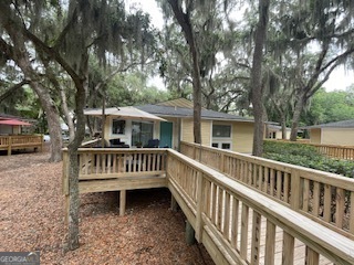 620 Executive Golf Villas Road St. Simons, GA 31522 - Photo 23 of 23 a view of a bench and a yard