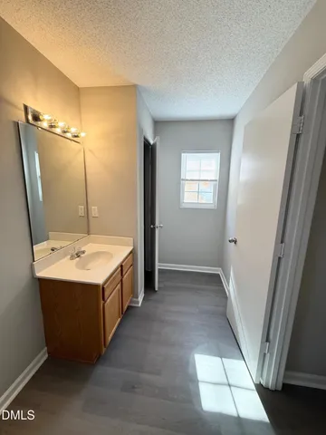 a bathroom with a double vanity sink and mirror