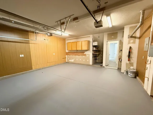 a view of empty room with wooden walls