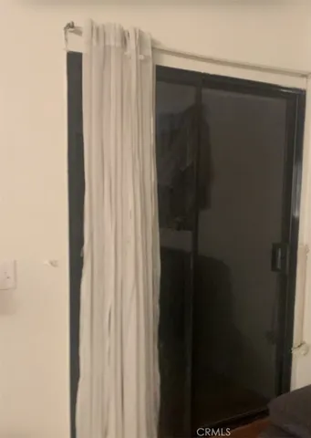 a bathroom with a shower and a curtain