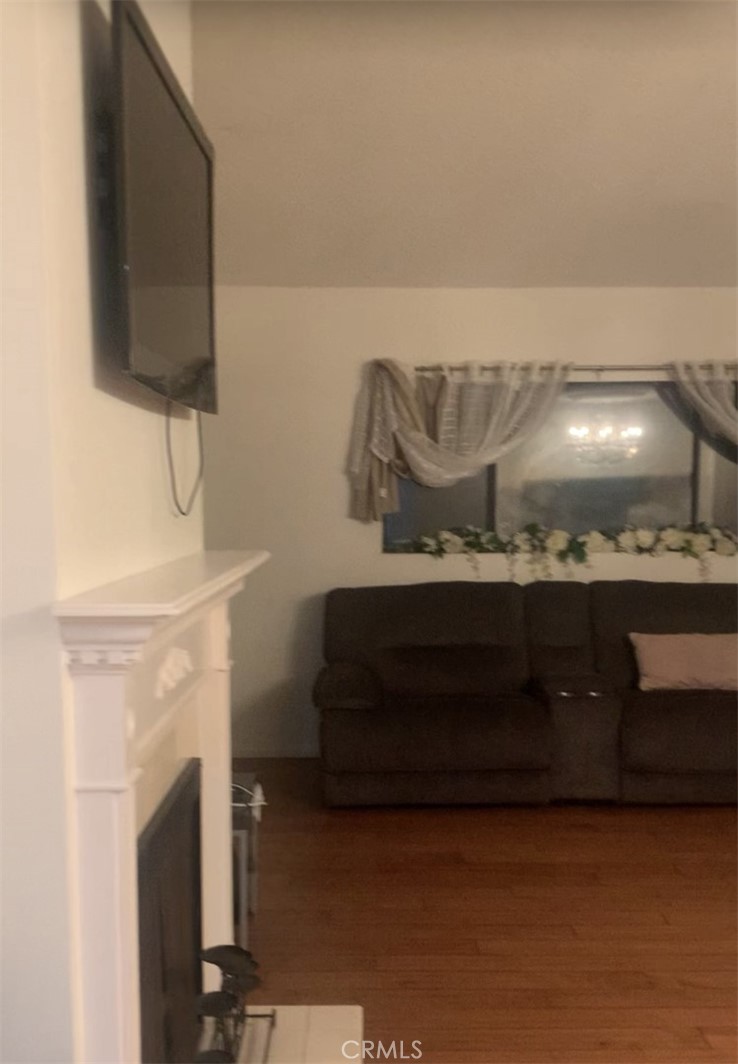 1758 2nd Street, Unit 204 Long Beach, CA 90802 - Photo 12 of 18 a living room with furniture and a fireplace