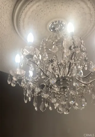 a view of a chandelier in big room