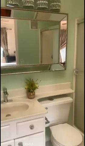 a bathroom with a toilet and a sink