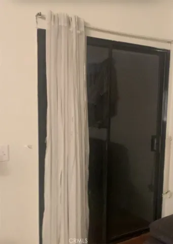 a bathroom with a shower and a curtain