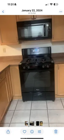a kitchen with a stove and a microwave