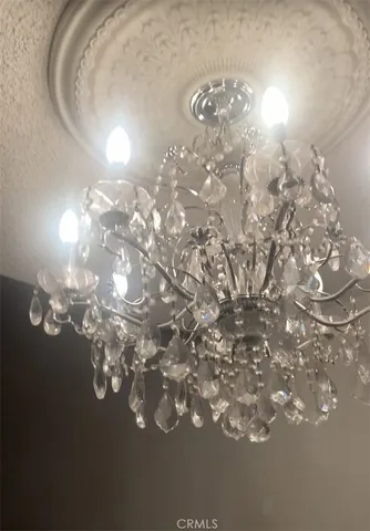 a view of a chandelier in big room